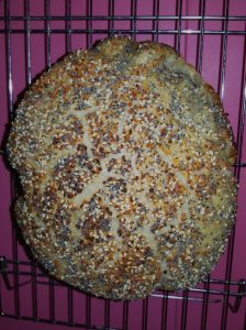 Dutch oven bread, topped with dried garlic, onion and poppy seeds